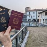 US and Italian passports held outdoors.