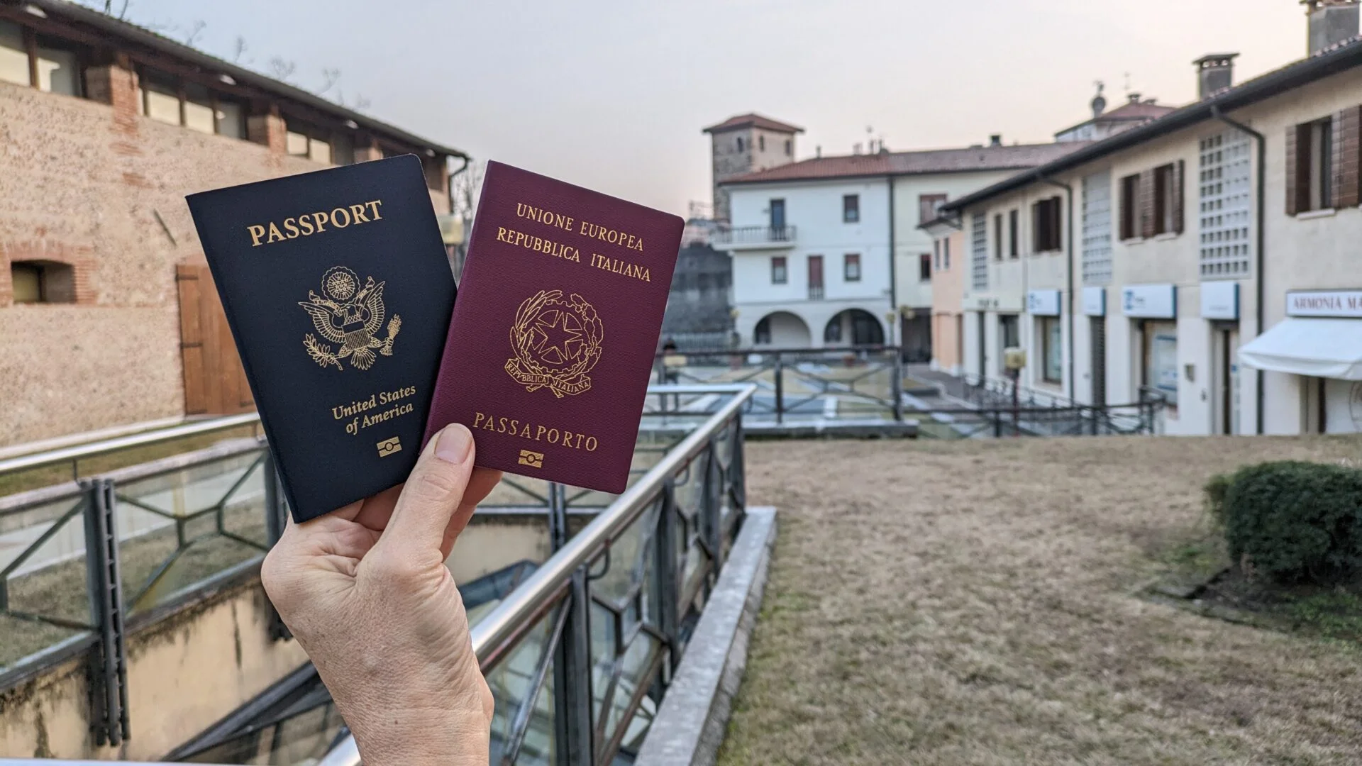 US and Italian passports held outdoors.